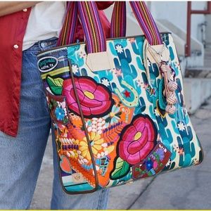 Consuela Dezi Classic tote new with tags and all charms, luggage tags included.